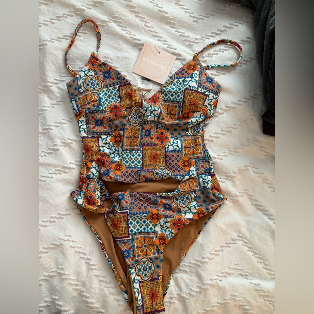 Kittenish one piece bathing suit- Size Small. Tags still on- never worn.